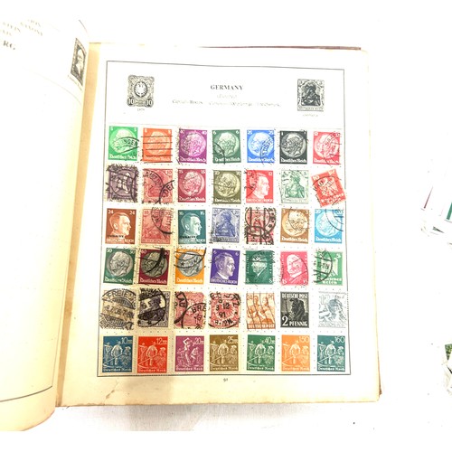 92 - Stamp album containing vintage and later assorted stamps and a selection of assorted cigarette cards