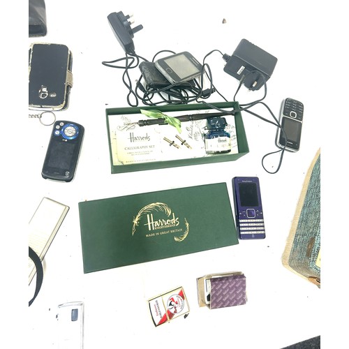 108 - Selection of miscellaneous to include electrical items radios, phones, pens etc