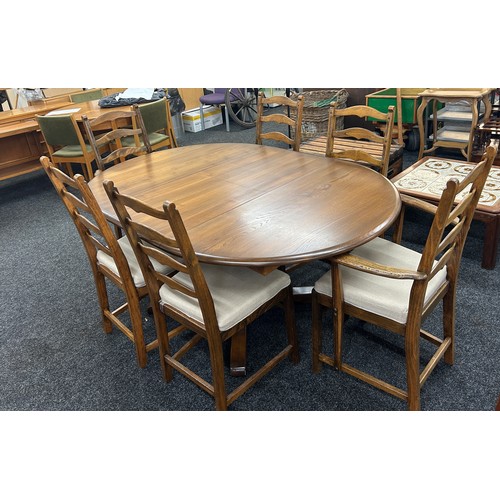 346 - Golden oak Ercol extendable oval table with four chairs and two carvers - measures approximately whe... 