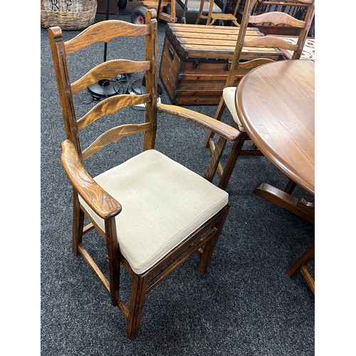 346 - Golden oak Ercol extendable oval table with four chairs and two carvers - measures approximately whe... 