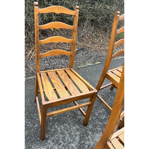 344A - Set of four golden oak Ercol ladder back chairs