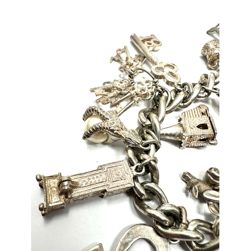 280 - Vintage silver charm bracelet and charms inc georg jensen st christopher & opening charms weight 73g