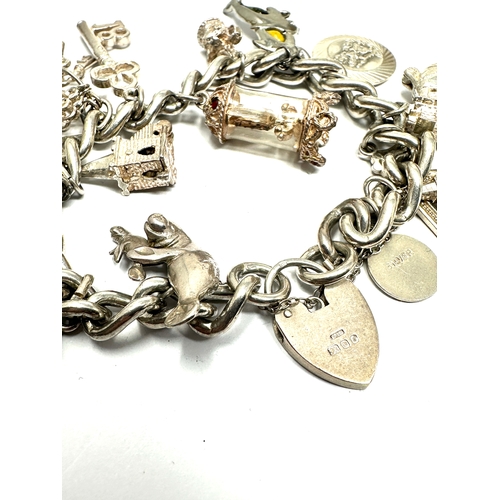 280 - Vintage silver charm bracelet and charms inc georg jensen st christopher & opening charms weight 73g