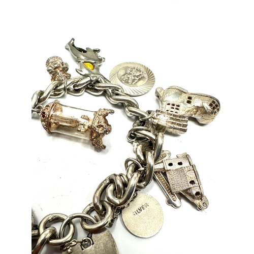 280 - Vintage silver charm bracelet and charms inc georg jensen st christopher & opening charms weight 73g