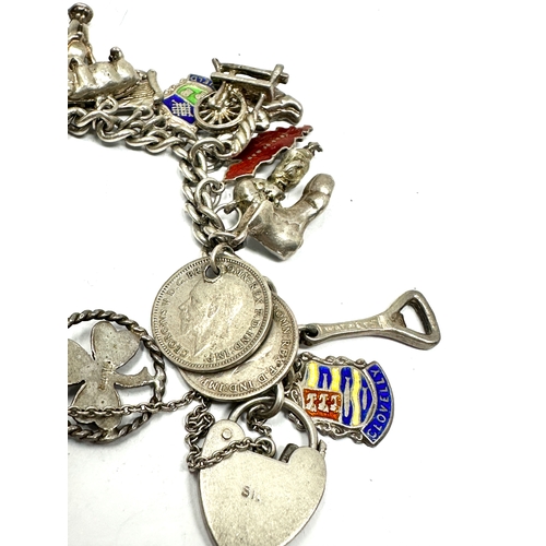 288 - Vintage silver charm bracelet & charms inc enamel town flags weight 65g