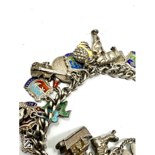 288 - Vintage silver charm bracelet & charms inc enamel town flags weight 65g