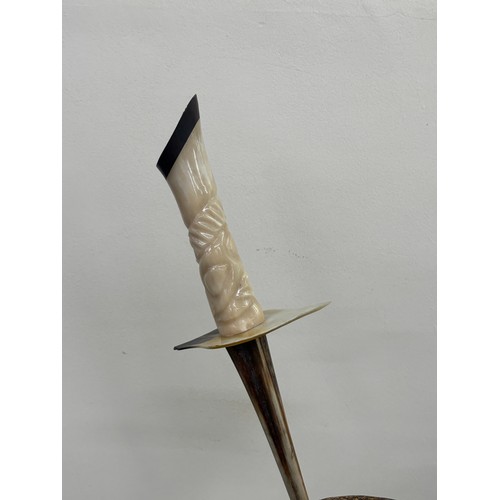 540 - ornamental horn dagger on horn on stand, approximate measurements: Height 20 inches