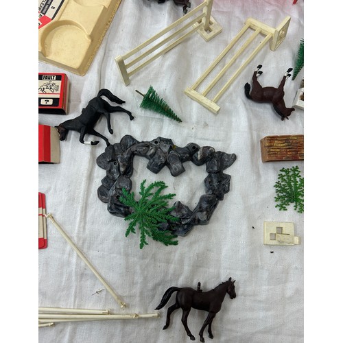 17 - Selection of vintage Britains horse figures and others, along with horse related toy accessories