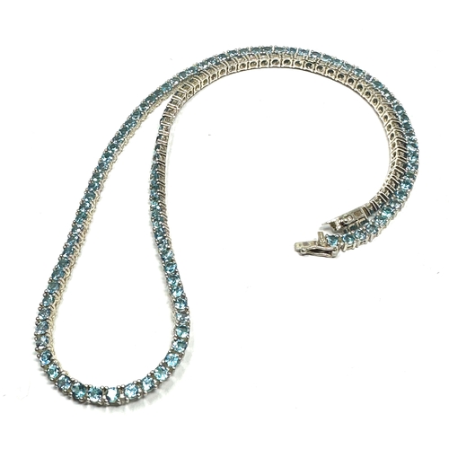 299 - Silver blue gemstone measures approx 47cm long