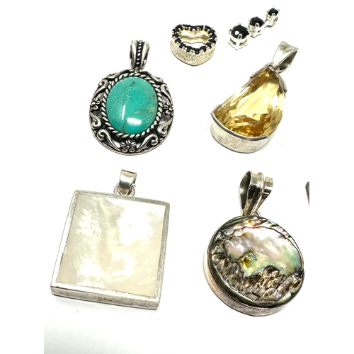 302 - selection of  silver gemstone set pendants