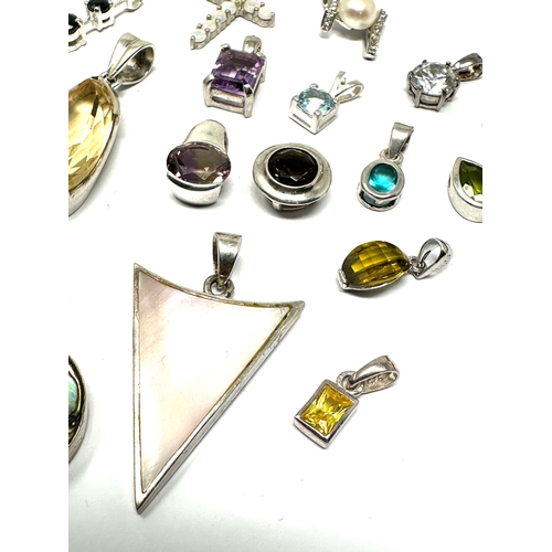 302 - selection of  silver gemstone set pendants