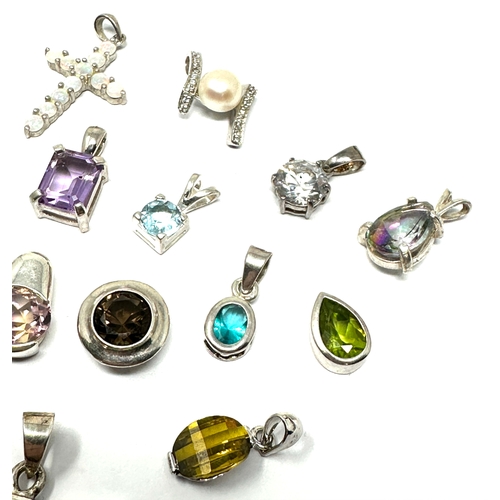 302 - selection of  silver gemstone set pendants