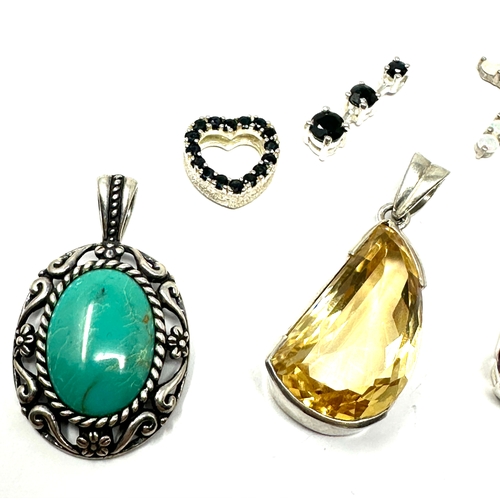 302 - selection of  silver gemstone set pendants