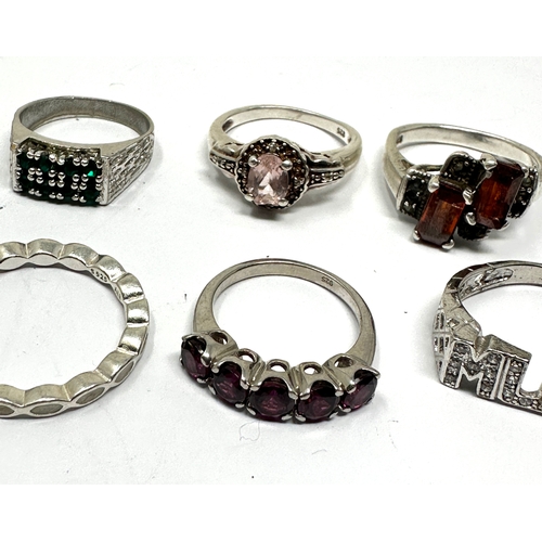 353 - 8 silver gemstone rings