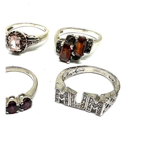 353 - 8 silver gemstone rings