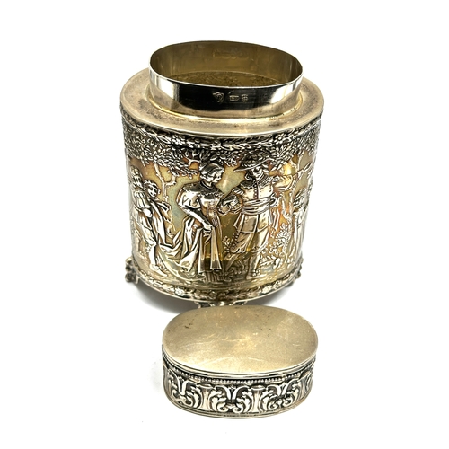 2 - Fine silver scenic embossed tea caddy measures approx height 12cm weight 150g