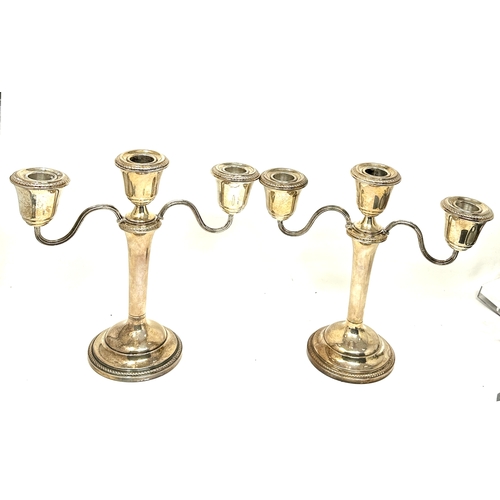 52 - pair of silver hallmarked candelabra  weigh approx 1260g  measure approx height 22cm by 22cm wide bi... 