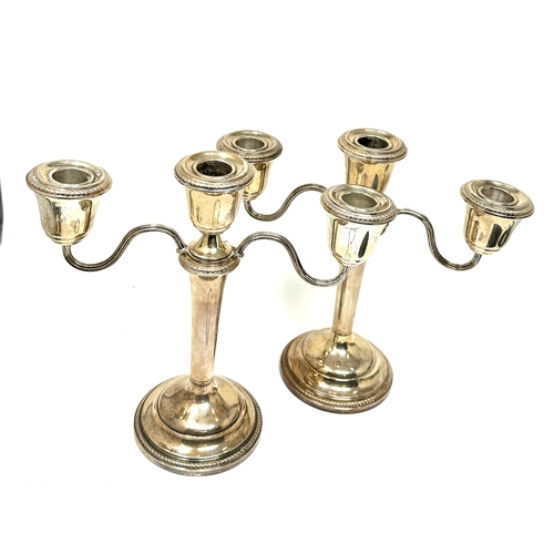 52 - pair of silver hallmarked candelabra  weigh approx 1260g  measure approx height 22cm by 22cm wide bi... 