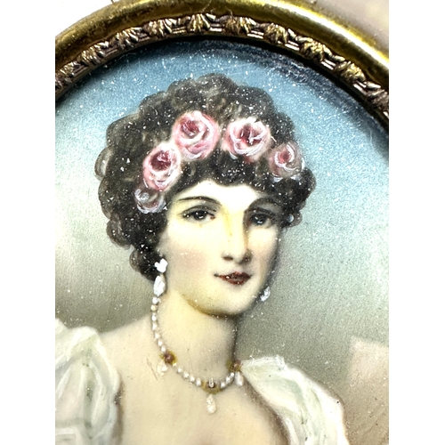 500 - Antique miniature painting of a young lady oval picture measures approx 5.3cm by 4.4cm