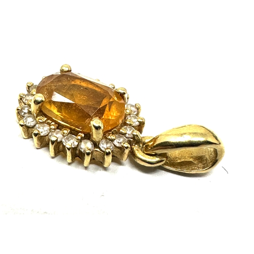 104 - 18ct gold citrine & diamond pendant measures approx 1.6cm drop weight 1.2g