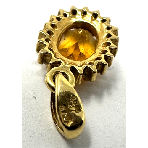 104 - 18ct gold citrine & diamond pendant measures approx 1.6cm drop weight 1.2g