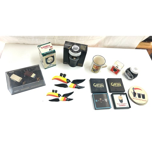 587 - Selection of Guinness memorabilia includes Money Box, marmite jar, Wall hanging toucans etc