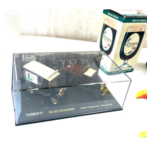 587 - Selection of Guinness memorabilia includes Money Box, marmite jar, Wall hanging toucans etc