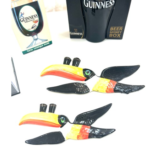 587 - Selection of Guinness memorabilia includes Money Box, marmite jar, Wall hanging toucans etc