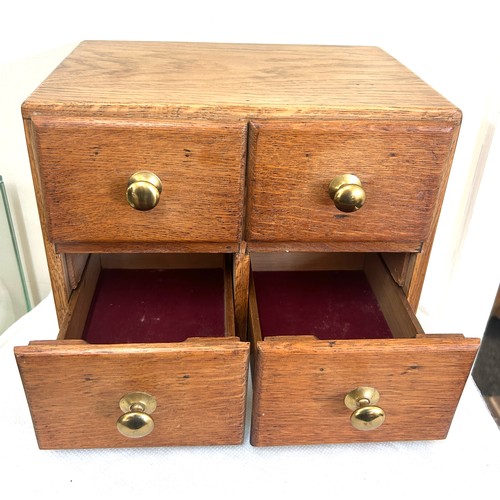 53 - Small oak 4 drawer chest measures approximately 10 inches tall 13 inches wide 9 inches depth