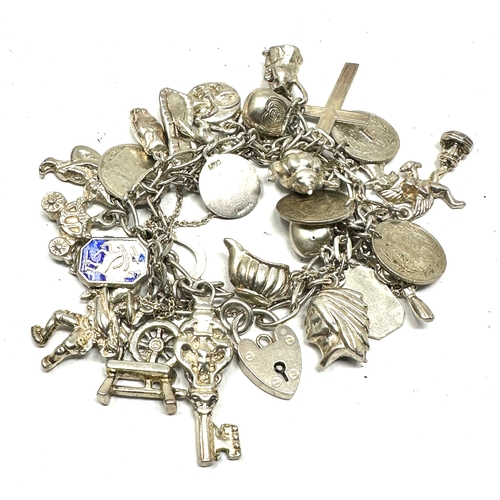 259 - Vintage silver charm bracelet and charms weight 91g