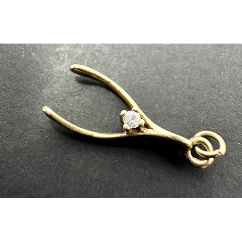 159 - Vintage 9ct gold wishbone charm weight .8 g