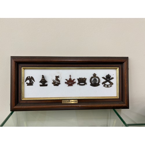 95 - Selection of 7 Royal Navy Division cap badges in frame