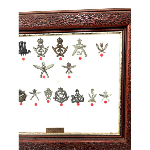 46 - Framed Gurkha cap badges