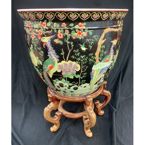 266 - Large oriental planter / fishbowl on wooden stand, approximate measurements of bowl Height 13 inches... 