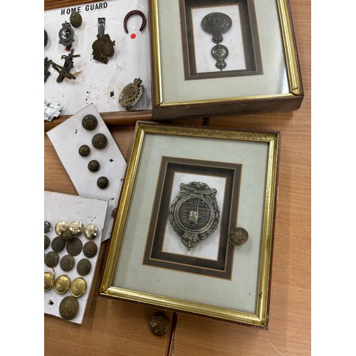 108 - Selection of assorted framed cap cadges, buttons and a signature