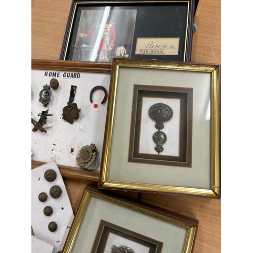 108 - Selection of assorted framed cap cadges, buttons and a signature