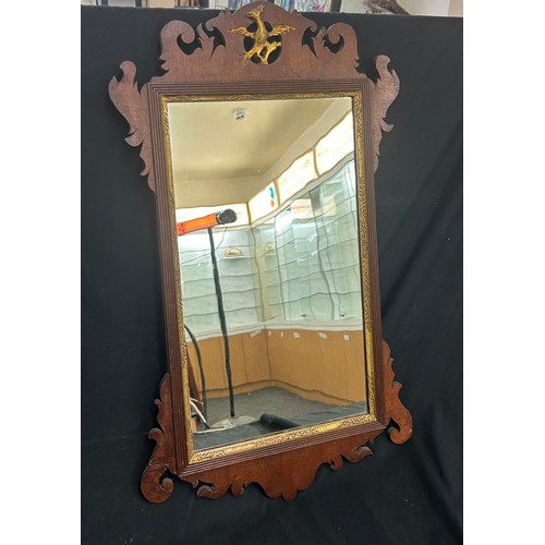 87 - Oak framed mirror measures approximately 20 inches tall x 16 wide