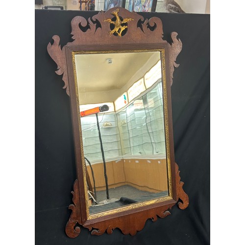 87 - Oak framed mirror measures approximately 20 inches tall x 16 wide