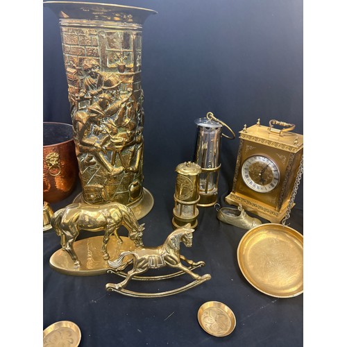 182 - Selection of brassware to include an umbrella stand, miners lamps, clock, rocking horse etc