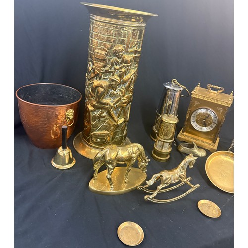 182 - Selection of brassware to include an umbrella stand, miners lamps, clock, rocking horse etc