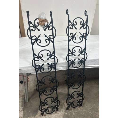 214 - Two wrought iron window grates measures approximately 38 inches tall x 10 wide