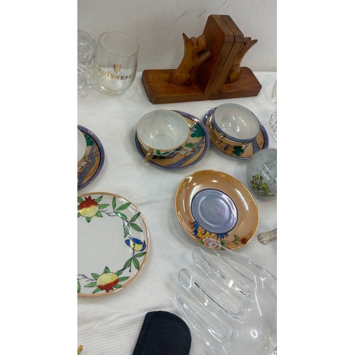 127 - Selection of miscellaneous to include wooden book ends, oriental cups and saucers, piece of Stuart c... 