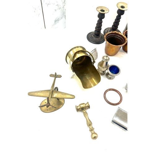 122 - Selection of assorted metal ware items to include brass shells, aeroplane figure, two copper moulds ... 