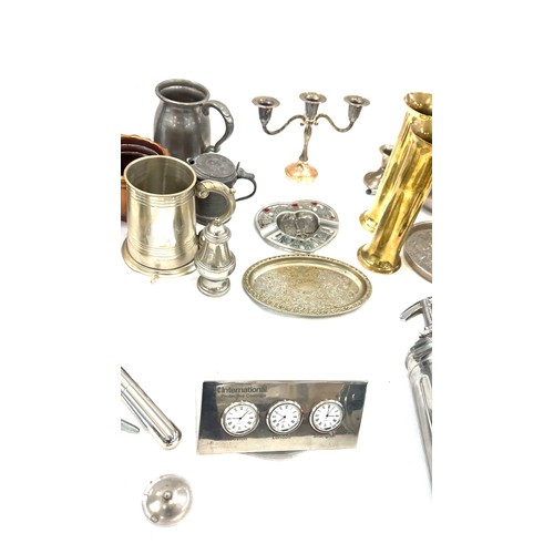 122 - Selection of assorted metal ware items to include brass shells, aeroplane figure, two copper moulds ... 