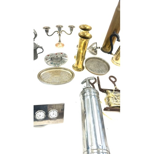 122 - Selection of assorted metal ware items to include brass shells, aeroplane figure, two copper moulds ... 