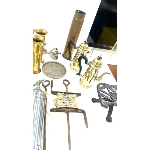 122 - Selection of assorted metal ware items to include brass shells, aeroplane figure, two copper moulds ... 