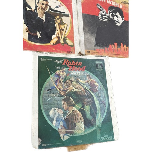 44 - Three vintage video discs to include ' Death Wish II', ' Gold Finger' and ' Robin Hood' - untested