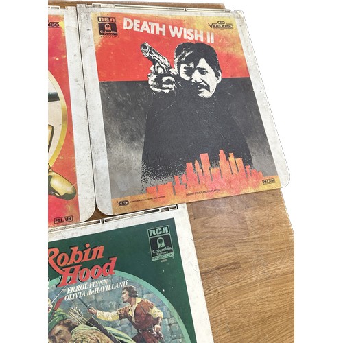 44 - Three vintage video discs to include ' Death Wish II', ' Gold Finger' and ' Robin Hood' - untested