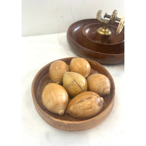 52 - Treen corkscrew nut cracker, 2 bowls of wooden eggs