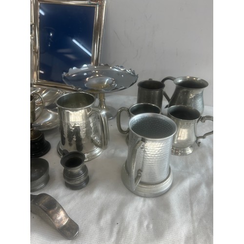 176 - Selection of pewter and silver plated items to include jugs, picture frame, candle stick etc